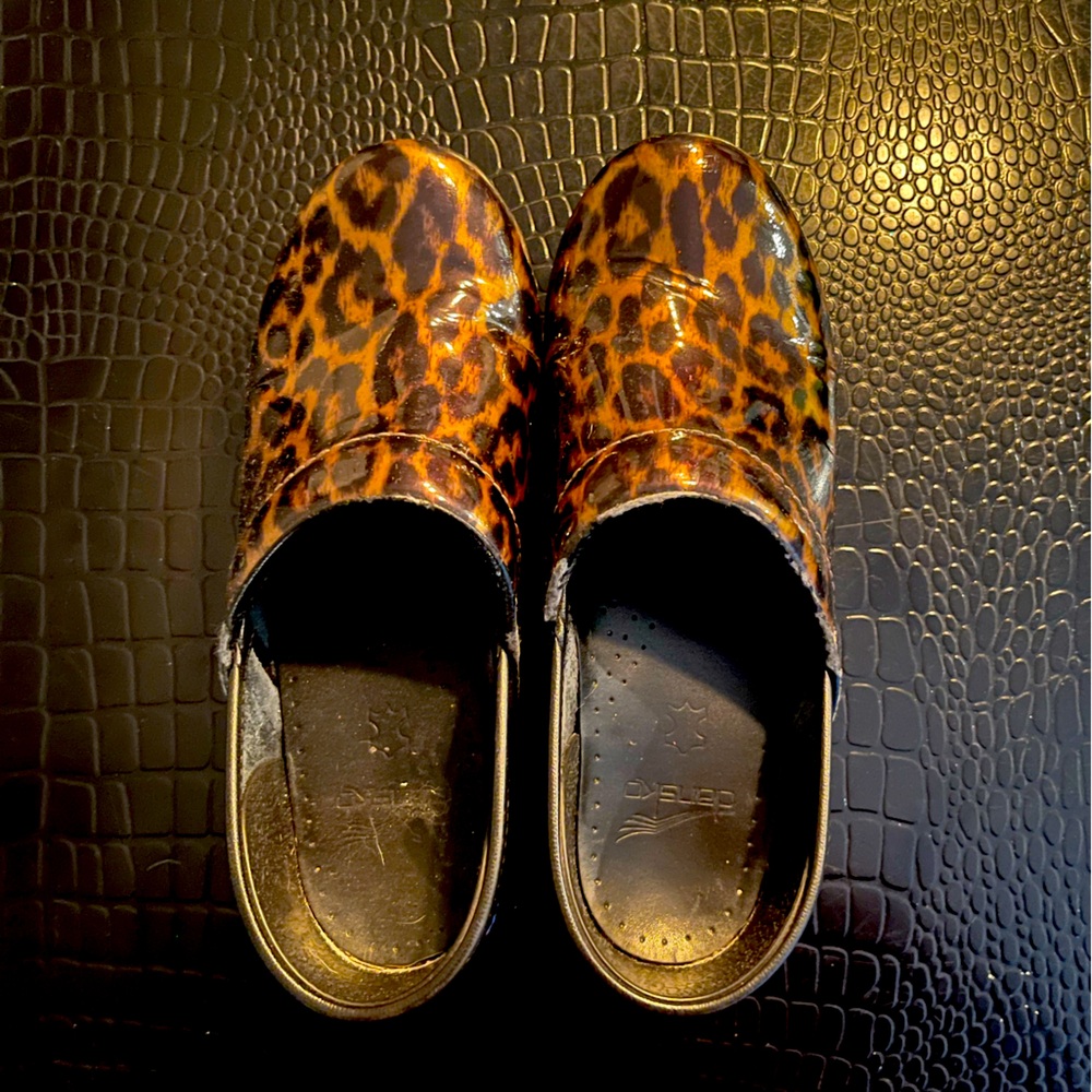 Dansko Leopard print patent leather clogs